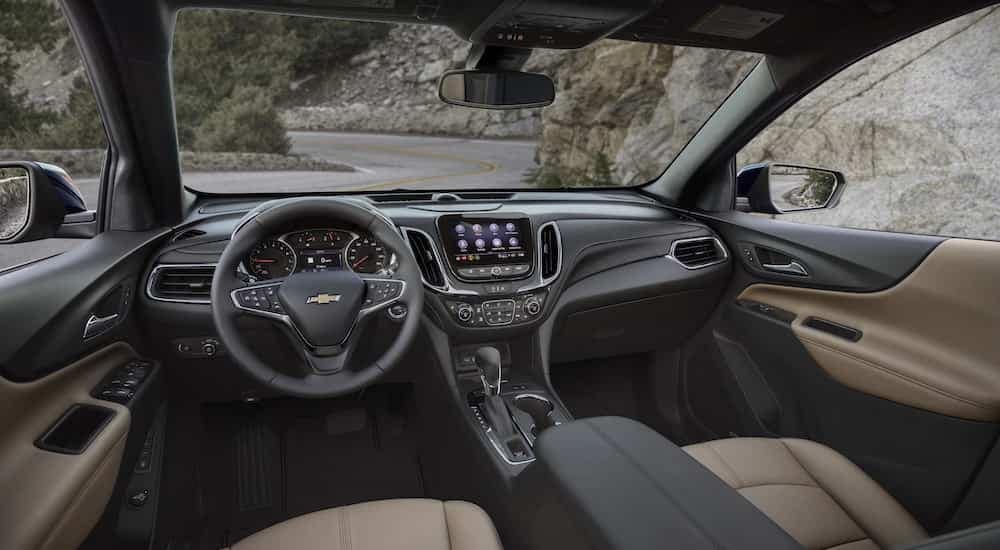 The brown interior of a 2024 Chevy Equinox Premier is shown from the driver's seat after leaving a Chevy dealer near Ann Arbor.